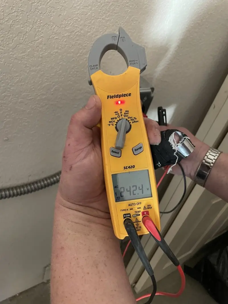 Voltage testing with clamp meter during Electrical Installation Services in Bull Mountain